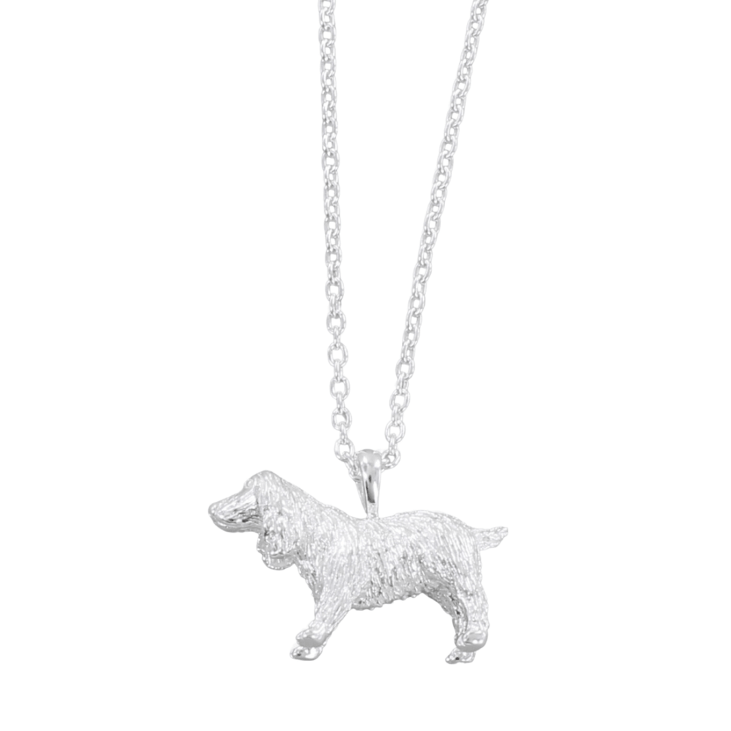 A sterling silver necklace featuring a pendant in the shape of a Spaniel dog, with an adjustable chain.