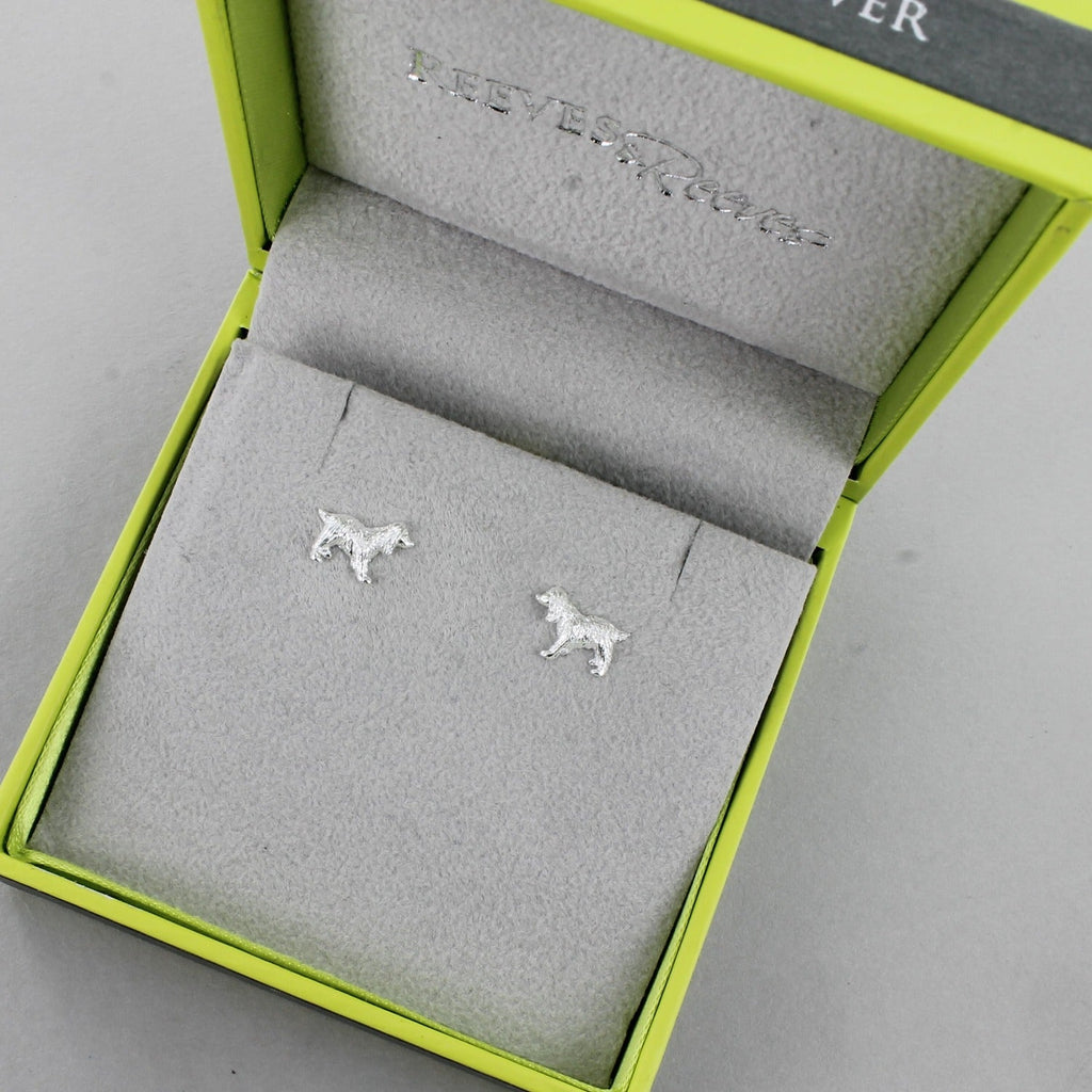 A sterling silver pair of spaniel stud earrings, shown in a Reeves & Reeves gift box.