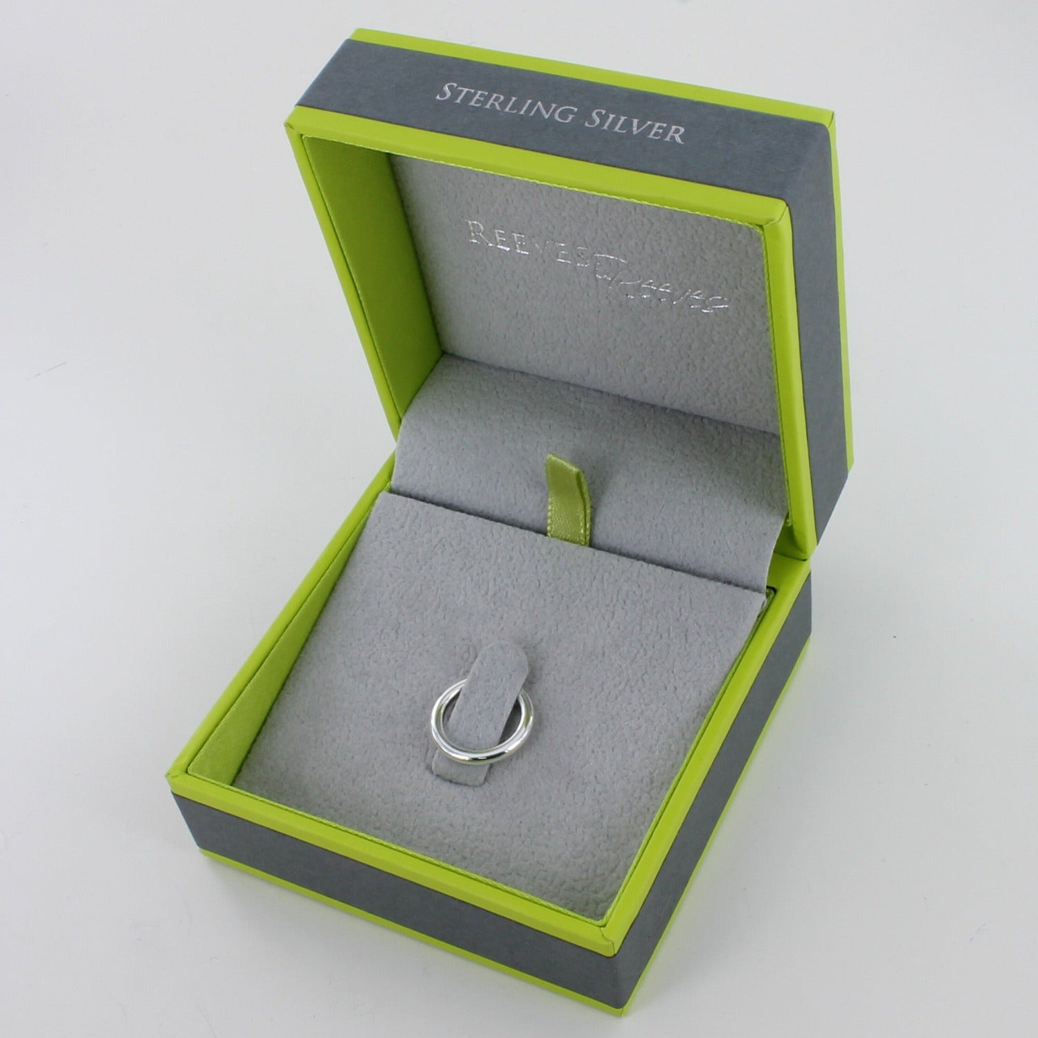 A single sterling silver ear cuff, shown in a Reeves & Reeves gift box.