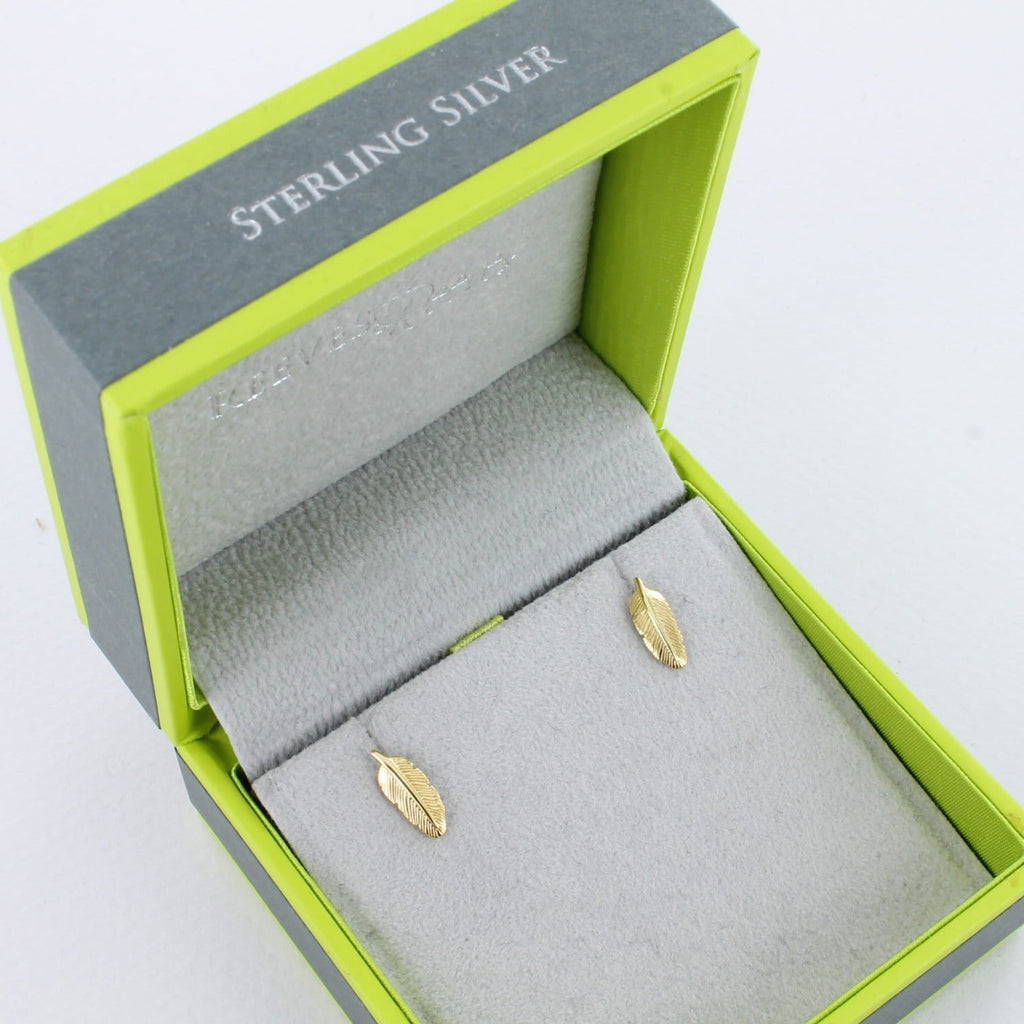A pair of sterling silver feather studs, in silver and 18ct gold plate and shown in a Reeves & Reeves gift box.