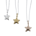 Three 3D star pendants, one silver, one gold and one rose gold plated, hung on silver chains.