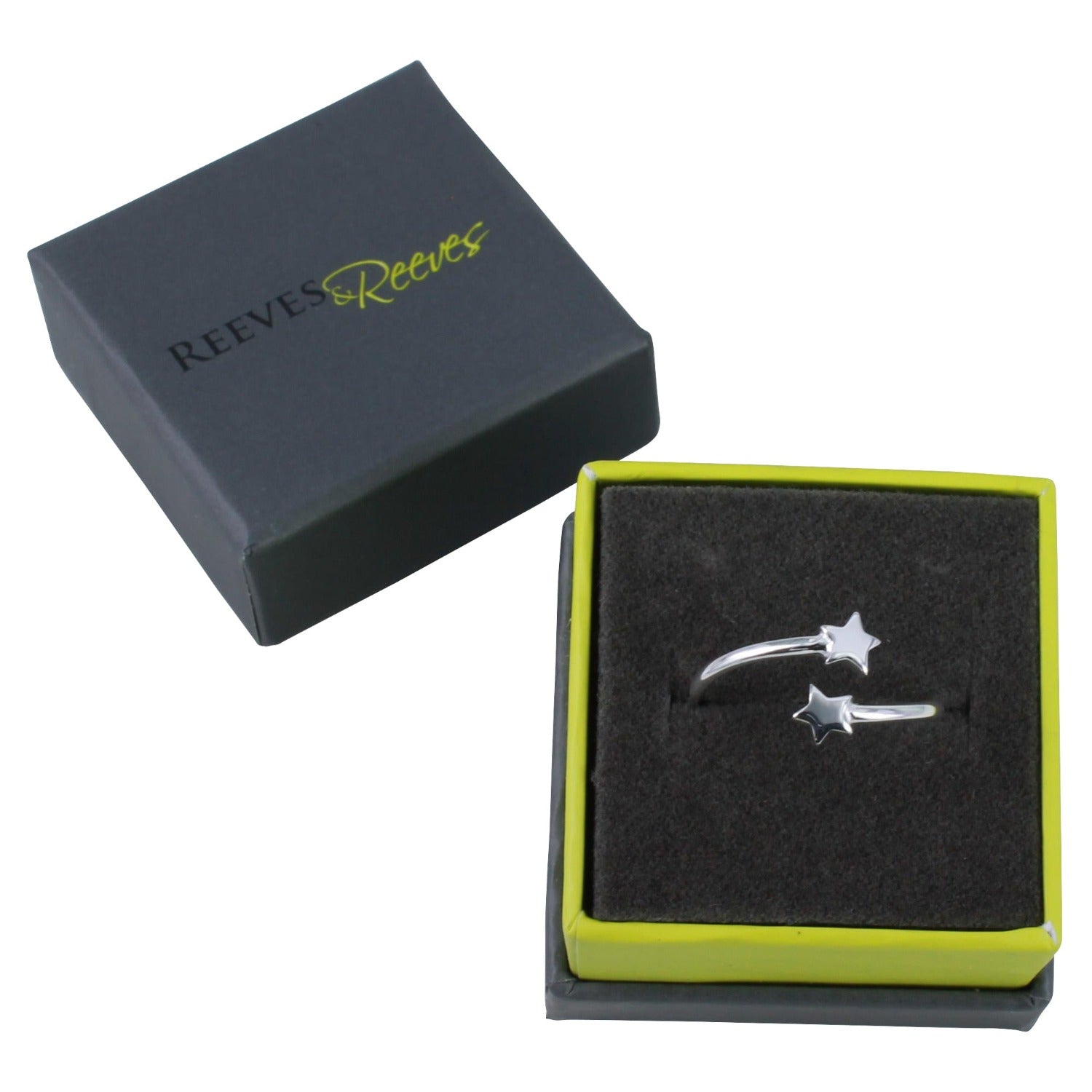 A silver adjustable ring with stars at either end, shown in a Reeves & Reeves grey and green branded gift box.