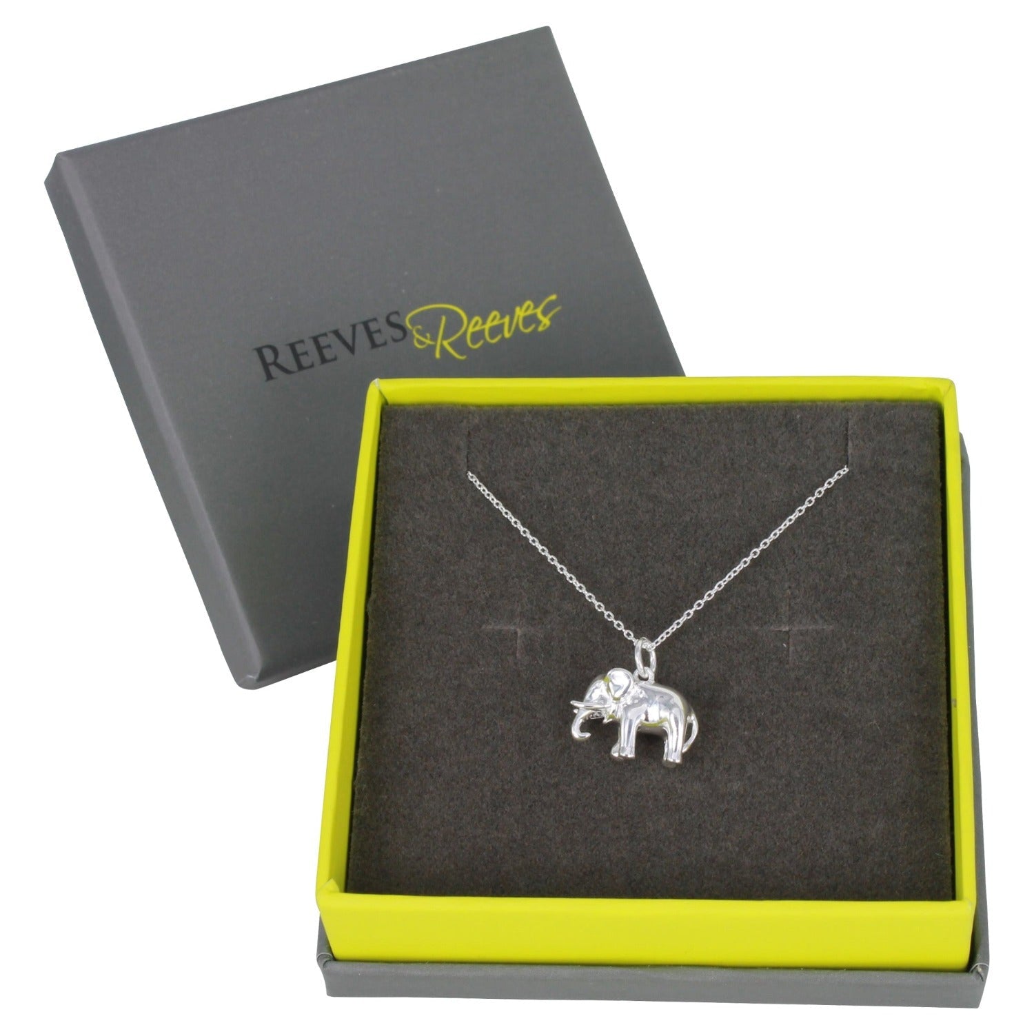 A 3D Silver Elephant Necklace, on a silver adjustable chain and shown in a Reeves & Reeves branded box in grey and green colours.