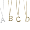 Sterling Silver Initial Necklaces, in silver or gold plate, letters shown are 'a, b, c, d'. On adjustable chains, in silver or gold plate.