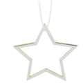 A Sterling Silver Star silhouette with gold plated edges and hung on a silver adjustable chain.