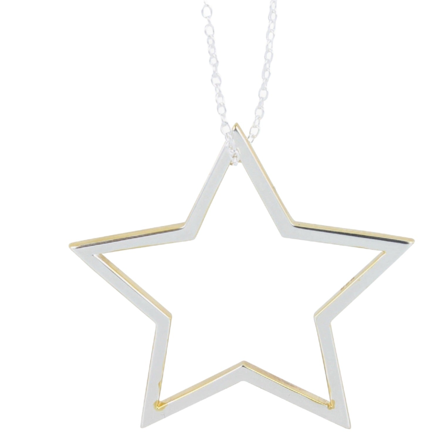 A Sterling Silver Star silhouette with gold plated edges and hung on a silver adjustable chain.