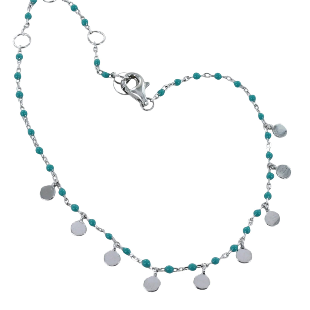 Fine chain Bracelet with turquoise beads and silver disc charms hanging from the chain. Finished with a lobster clasp.