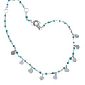 Fine chain Bracelet with turquoise beads and silver disc charms hanging from the chain. Finished with a lobster clasp.