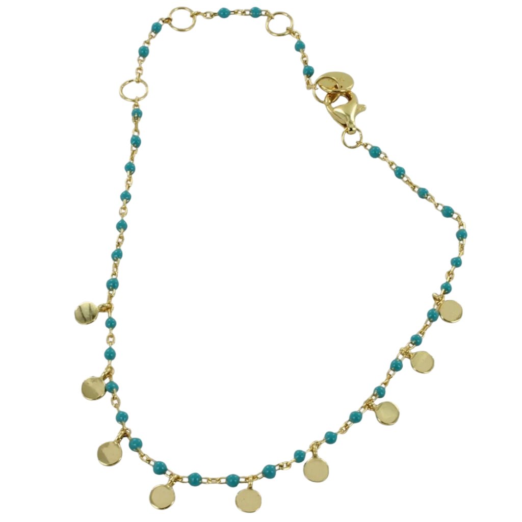 Fine chain bracelet with turquoise beads and gold plated on silver disc charms hanging from the chain. Finished with a lobster style clasp.