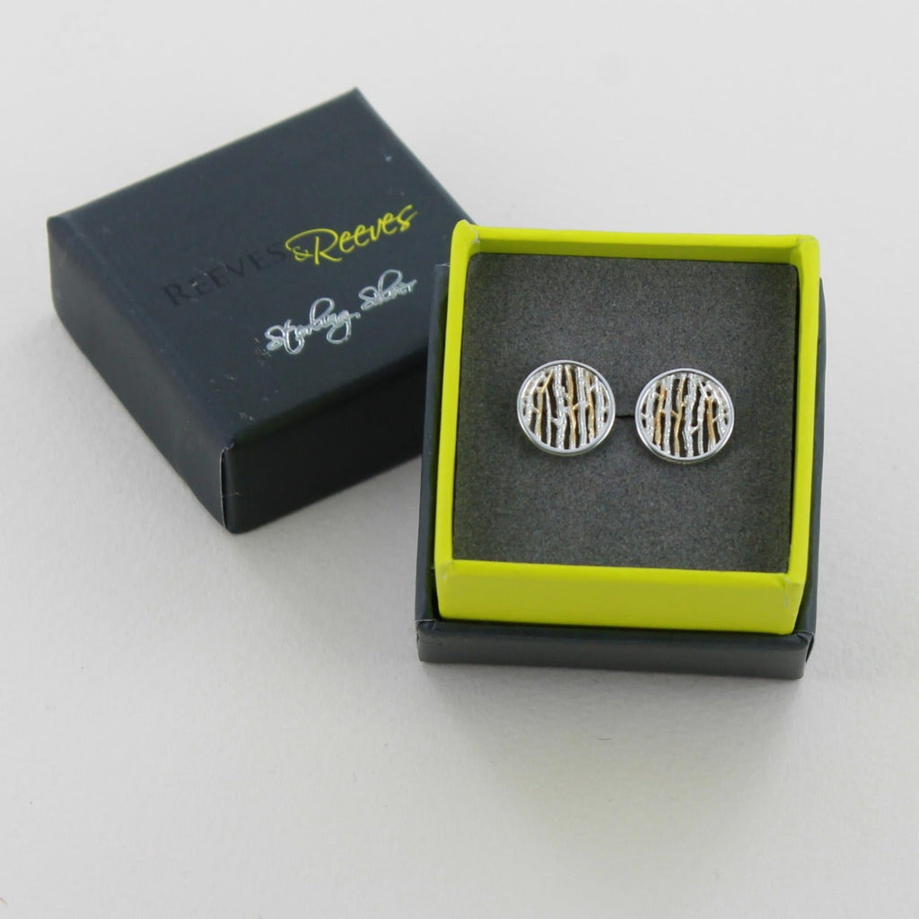 A pair of Silver Birch Earrings with 18ct gold plate detail and shown in a Reeves & Reeves grey and green gift box.