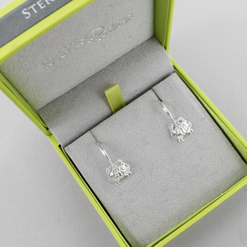 A pair of sterling silver Crab Drop Earrings, on silver hooks and shown in a Reeves & Reeves gift box.