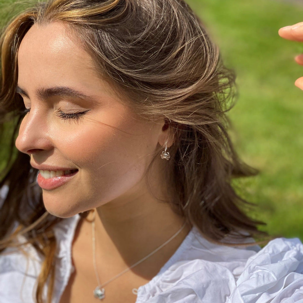 A sterling silver Crab drop earring, shown worn on a model.