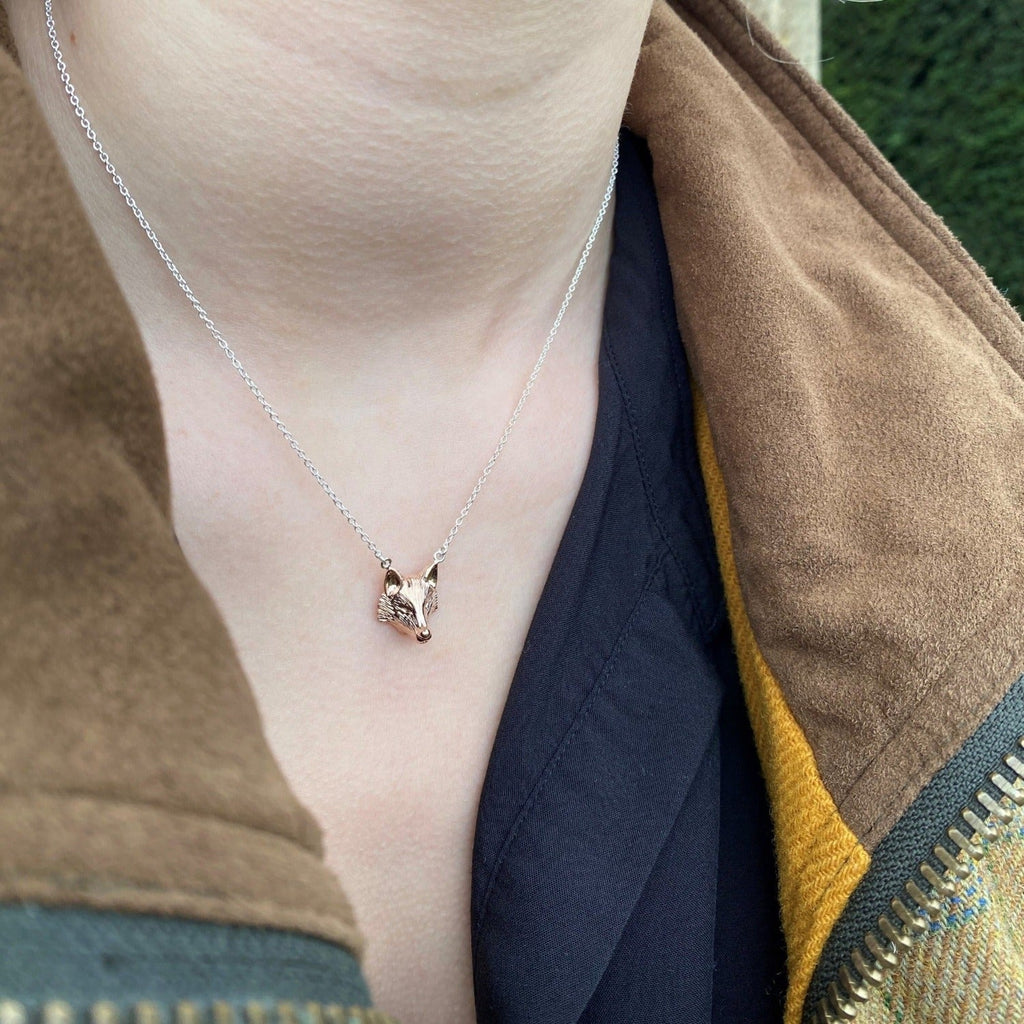 Silver Fox Head Necklace with rose gold plating on a sterling silver chain, worn on a model.