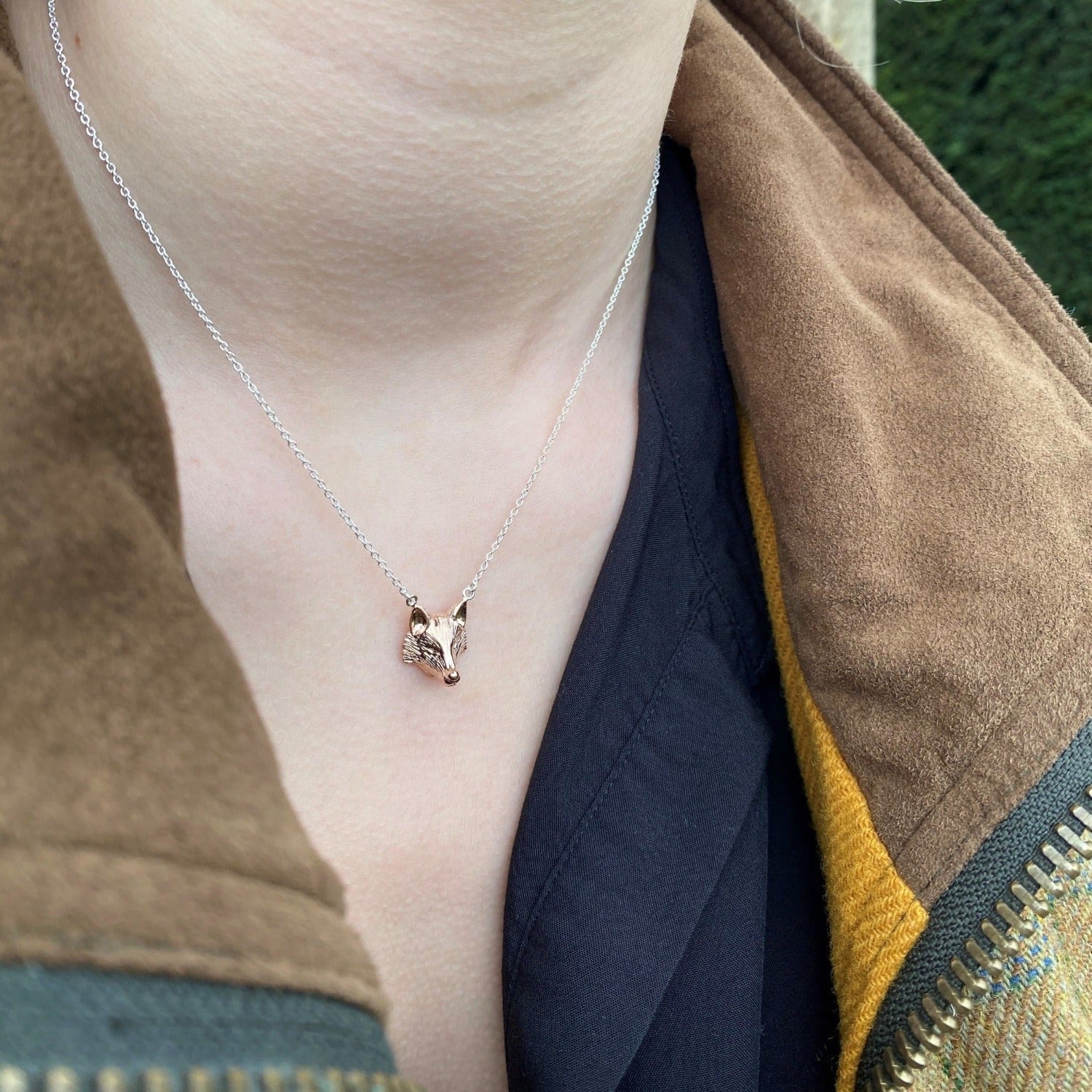 Silver Fox Head Necklace with rose gold plating on a sterling silver chain, worn on a model.