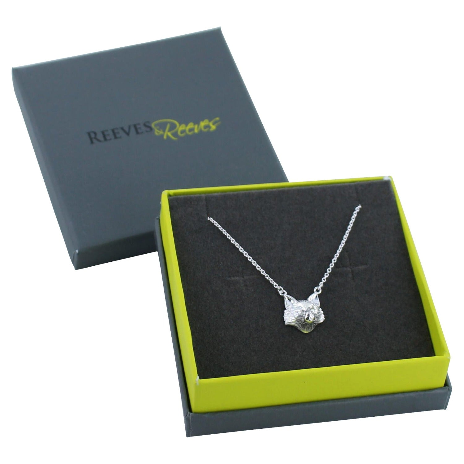 Silver Fox Head Necklace on a silver chain, shown in a Reeves & Reeves branded box in grey and green colours.
