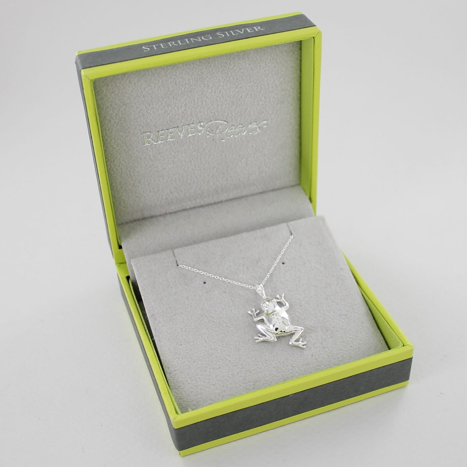 Sterling Silver Frog Pendant on a silver chain and shown in a Reeves & Reeves grey and green branded gift box.