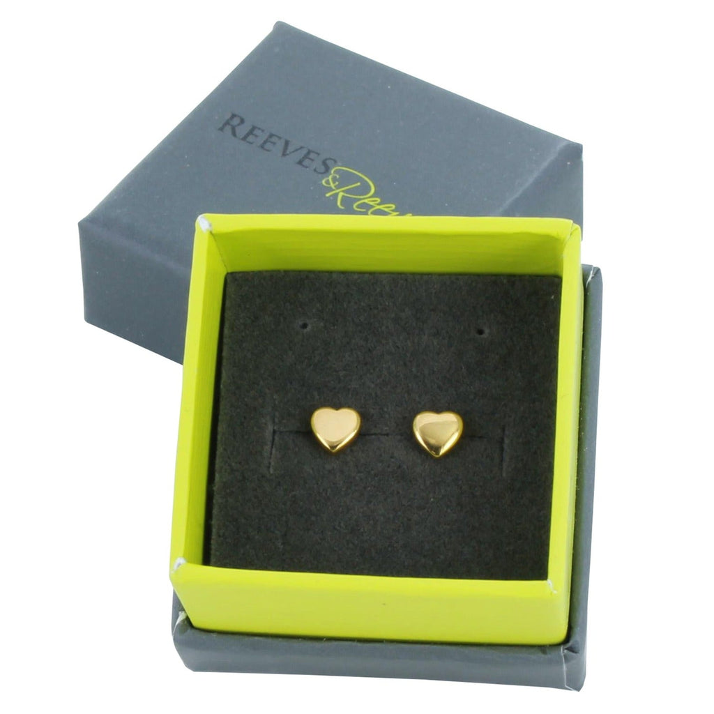 A pair of sterling silver heart stud earrings, in silver with 18ct gold plate and shown in a Reeves & Reeves gift box.
