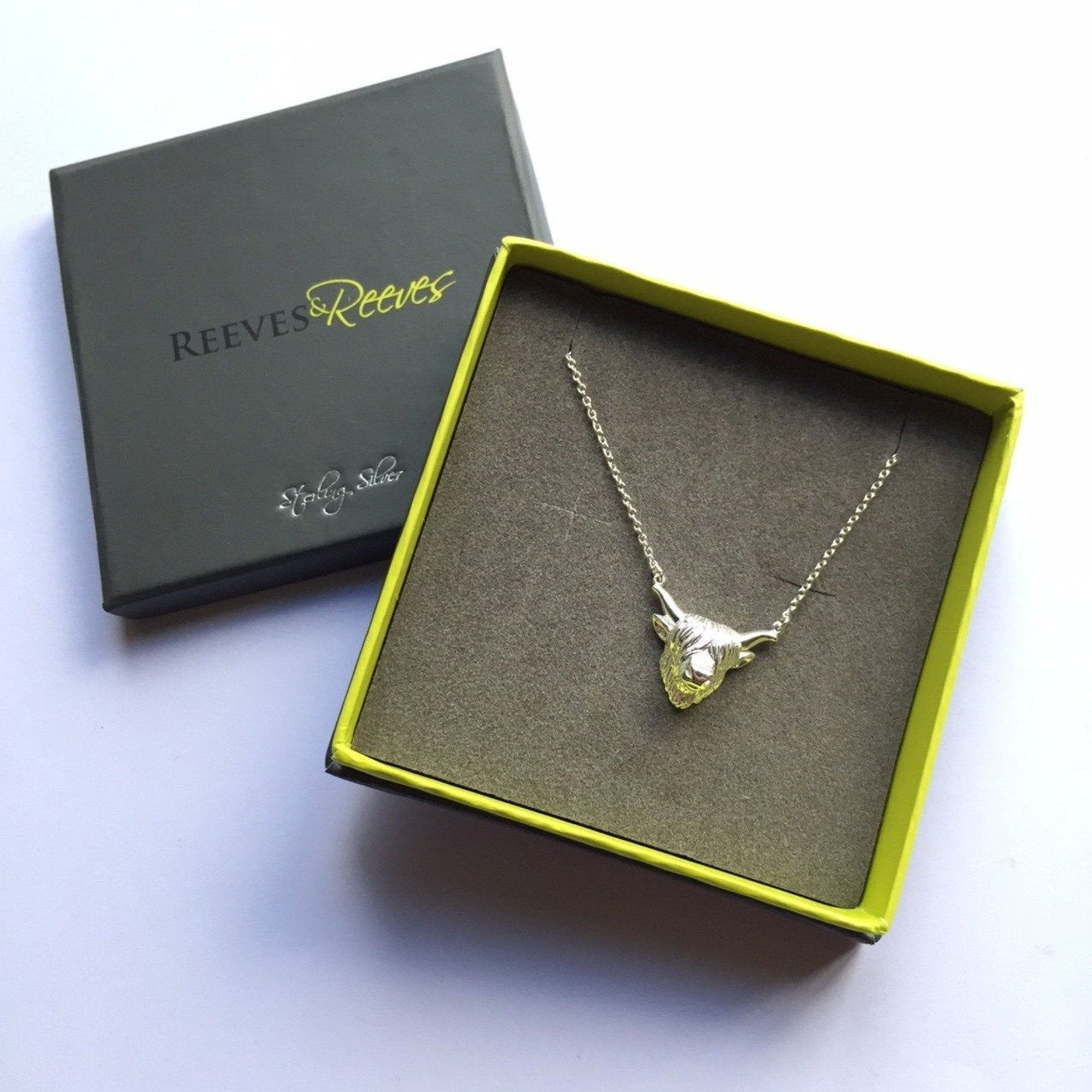 Sterling Silver Highland Cow Necklace in a Reeves & Reeves branded gift box with green outside and grey insert. Nature inspired gifts for her.
