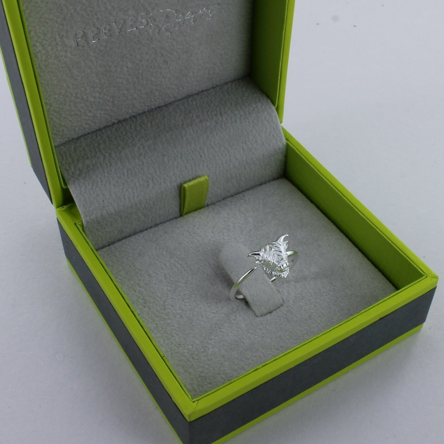 Sterling silver Highland cow ring, shown in a Reeves and Reeves grey and green branded gift box.