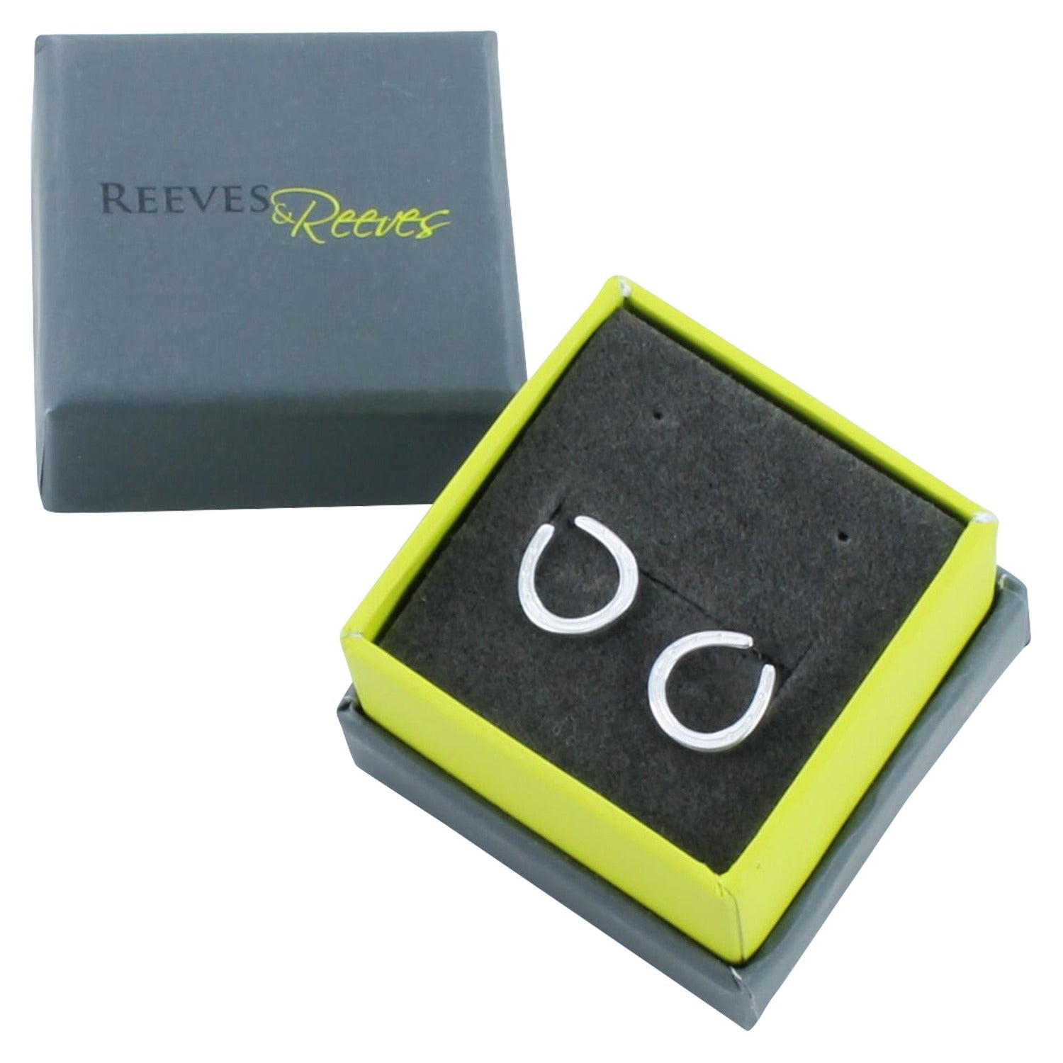 A pair of Sterling Silver Horseshoe Stud Earrings, shown in a Reeves & Reeves gift box.