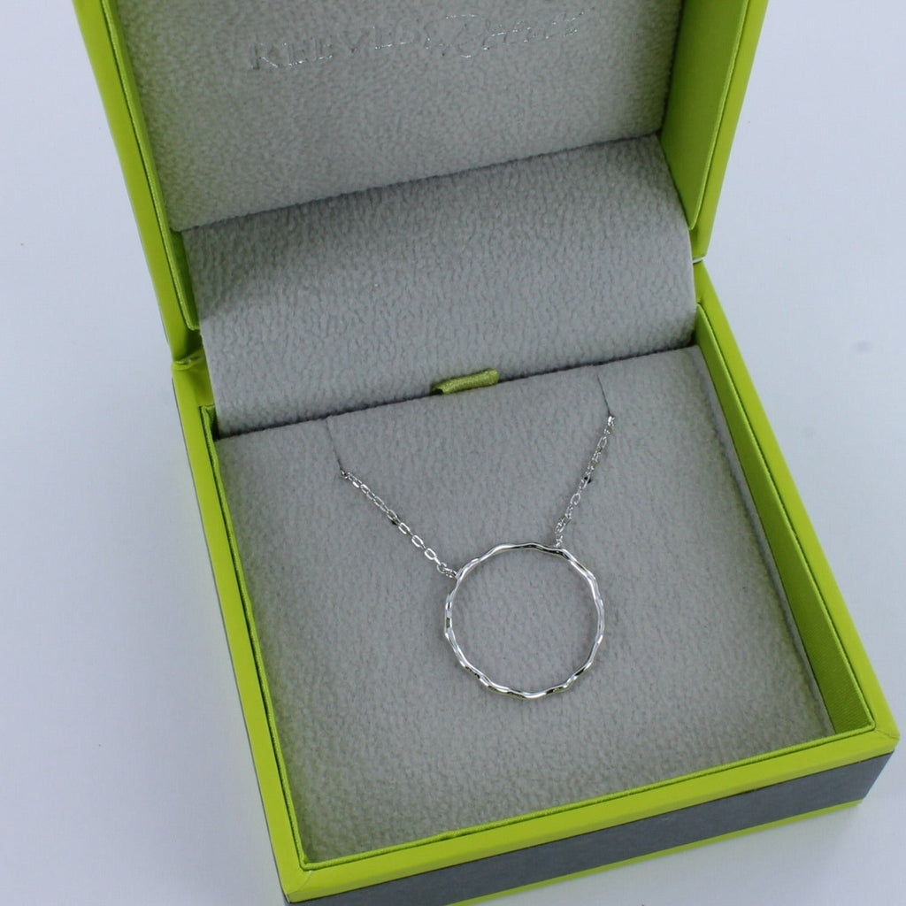 Sterling Silver Hula Hoop Necklace, shown in a Reeves & Reeves grey and green branded gift box.