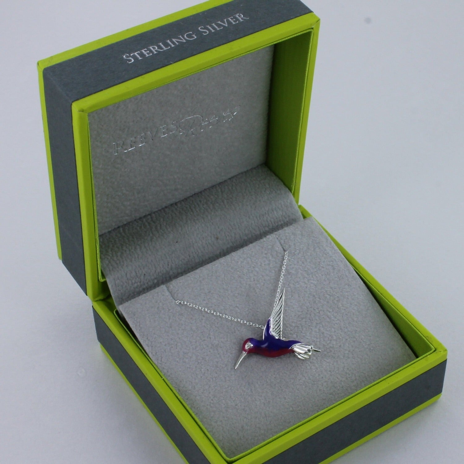 Sterling Silver with Pink and Purple Enamel Humming Bird Necklace in a Reeves & Reeves, grey and green branded box. Nature inspired gift for her.