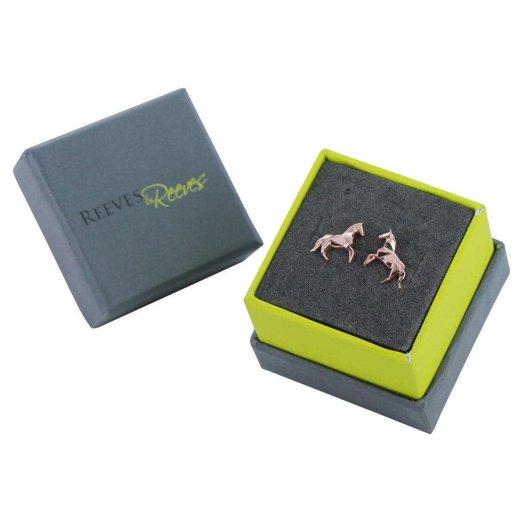 A pair of sterling silver horse stud earrings with 18ct rose gold plating. Shown in a Reeves & Reeves gift box.