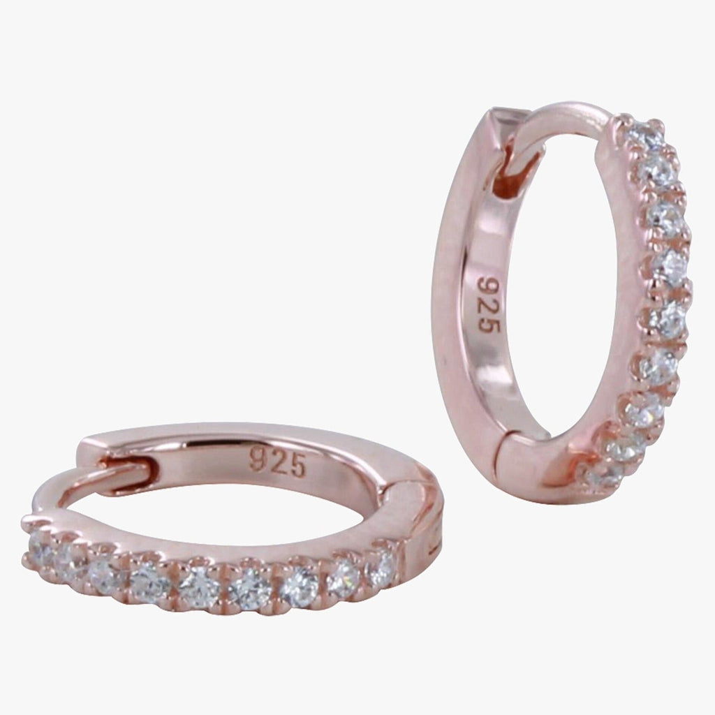 A pair of sterling silver huggies with 18ct rose gold plating with cubic zirconia stones on the front.