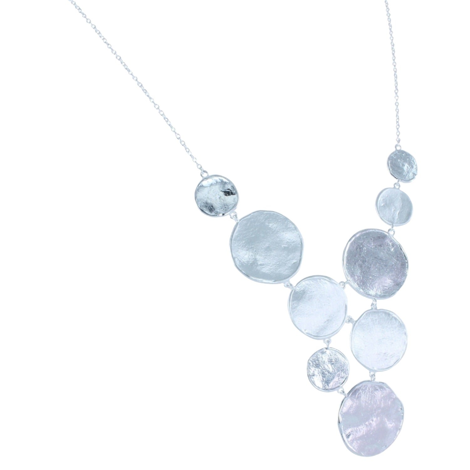 Sterling Silver discs with varying finishes, set in a waterfall style design and hanging on a silver adjustable chain.