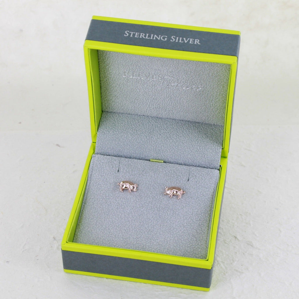 A pair of pig stud earrings, in sterling silver with 18ct rose gold plating. Shown in a Reeves & Reeves gift box.