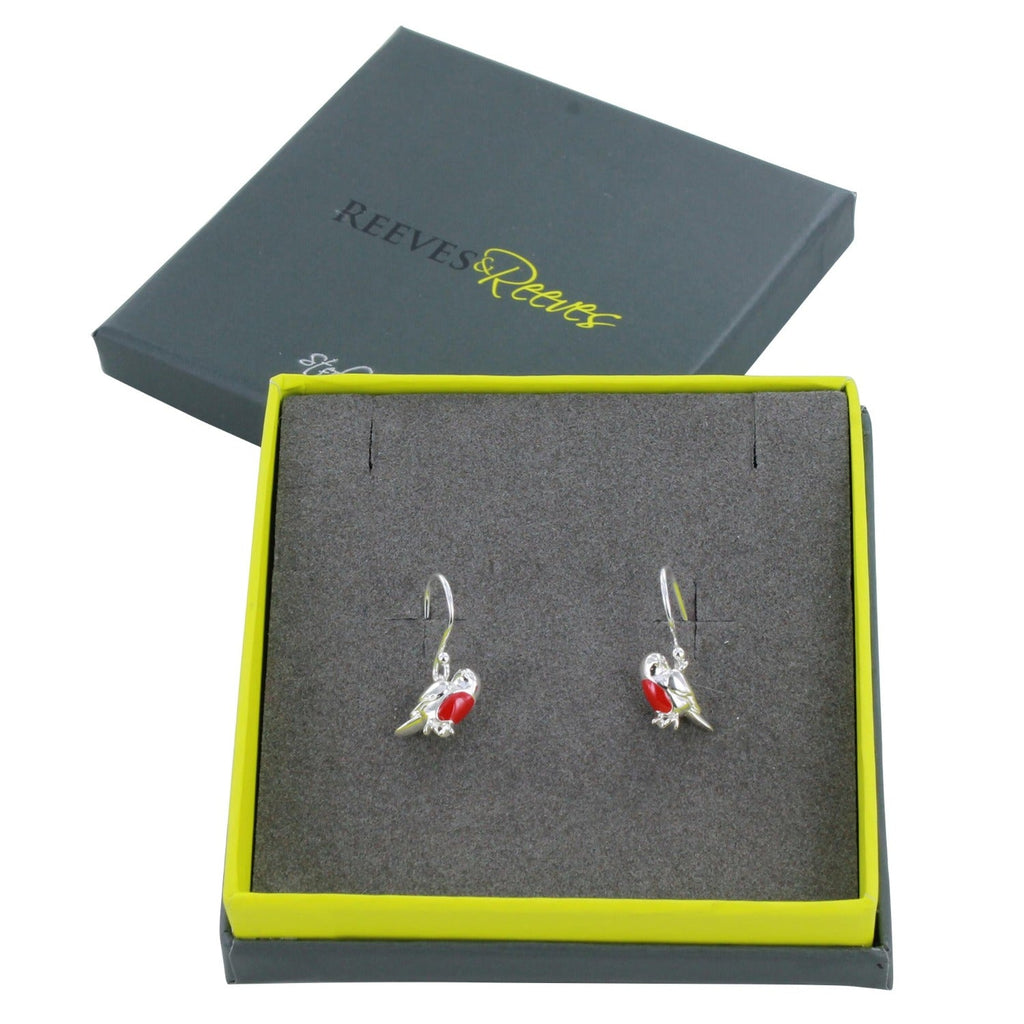 A pair of sterling silver Robin Earrings on silver hooks. The robins have red enamel detail on their breast and are shown in a Reeves & Reeves gift box.