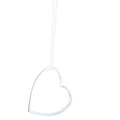 A sterling silver heart silhouette necklace with gold vermeil edges, hanging from an adjustable sterling silver chain.