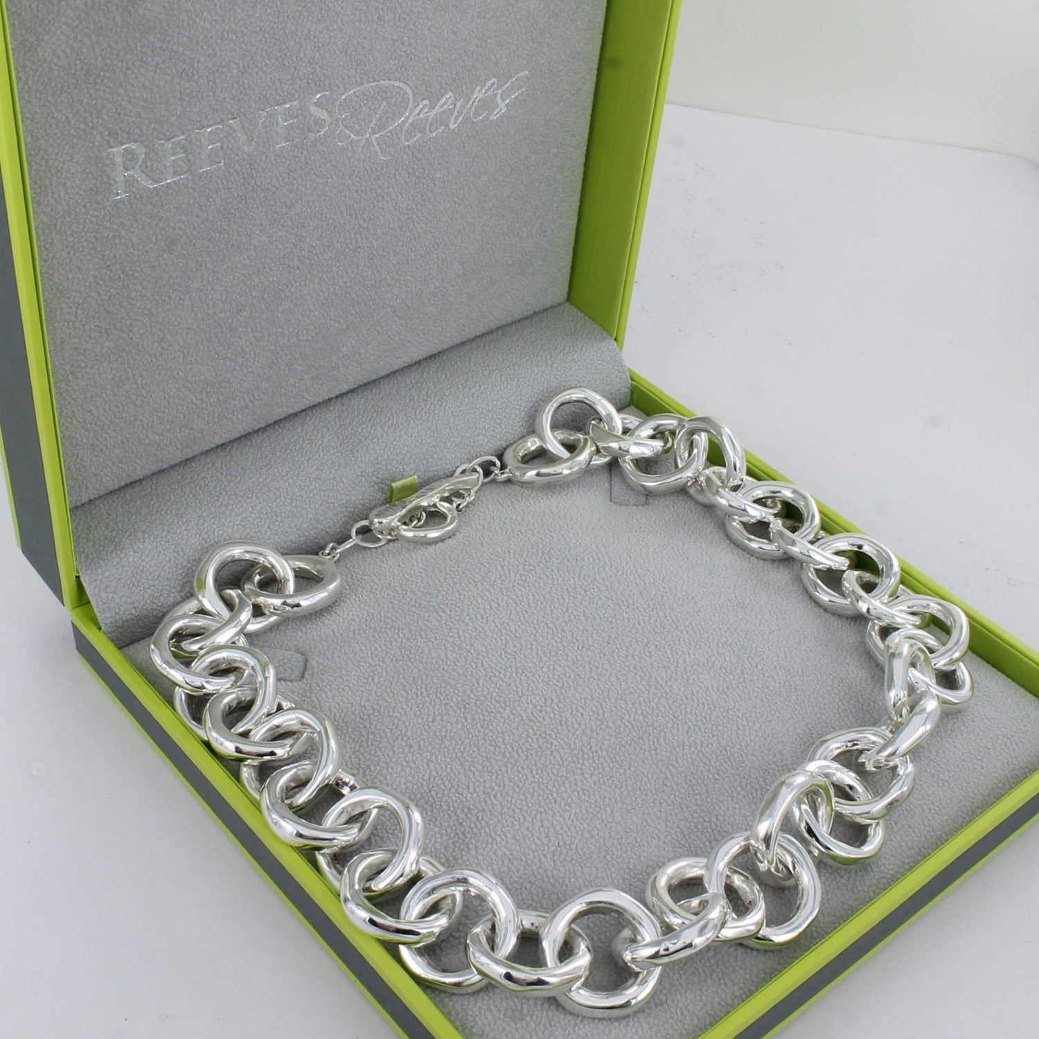 A sterling silver necklace comprised of solid silver interlinking rings in a continuous motion around the neck and finished with a t bar clasp.