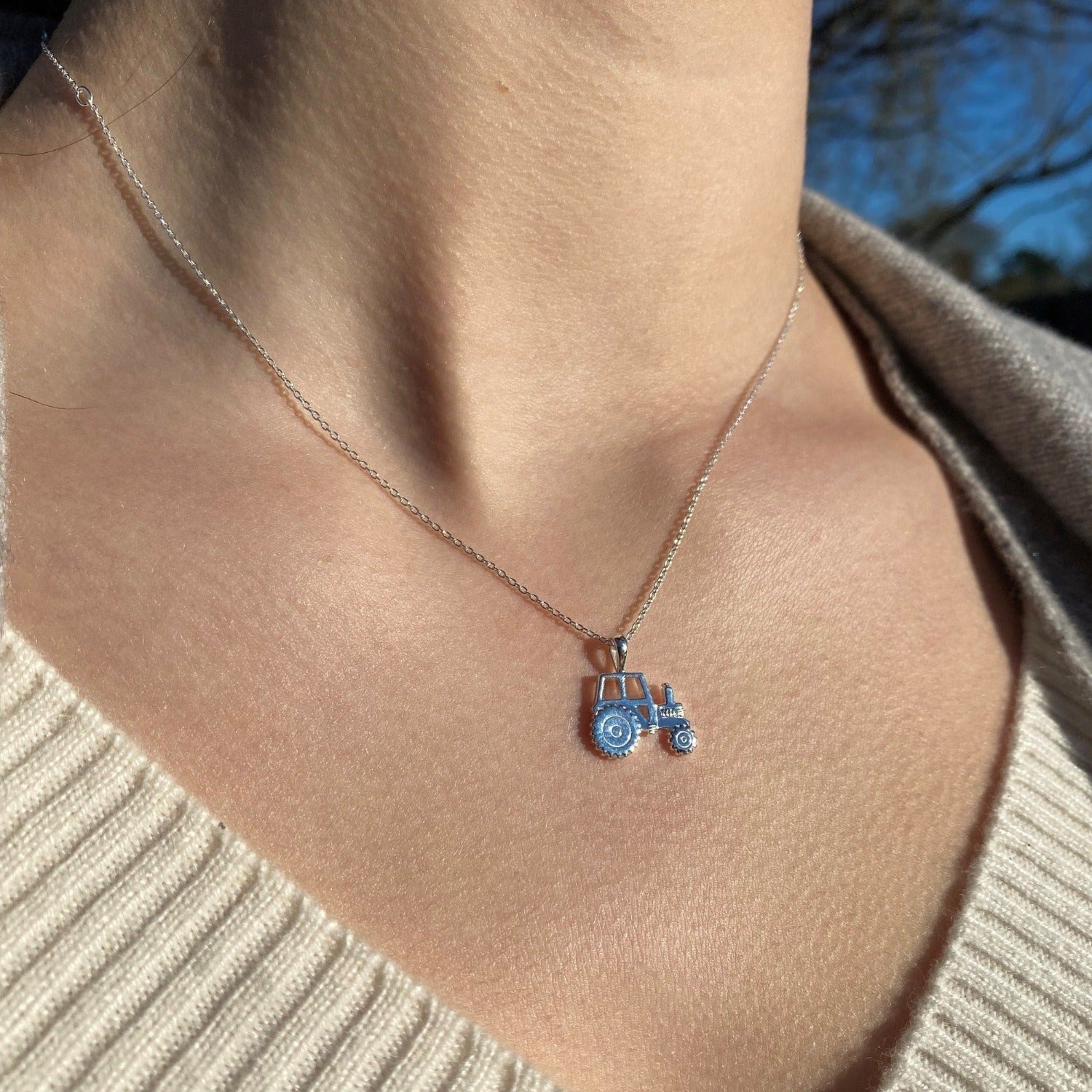 Silver Tractor Pendant on an adjustable silver chain, worn on a ladies neck.