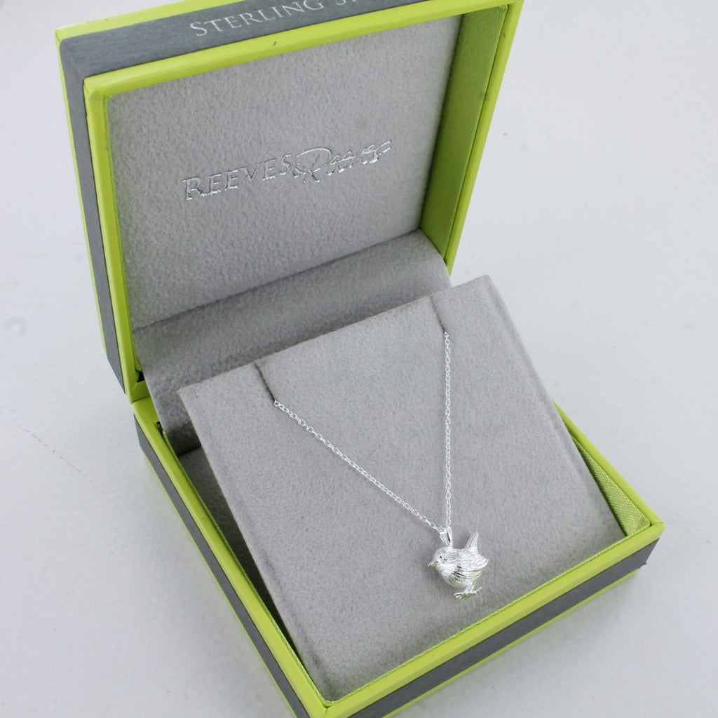 Sterling Silver Wren Necklace in a Reeves & Reeves branded gift box. The box is brand colours, grey and green, with a grey insert and Sterling Silver on the outside of the box.