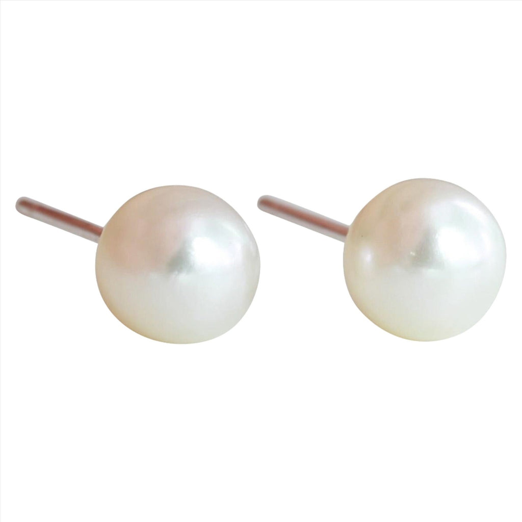 A pair of white freshwater pearl stud earrings.